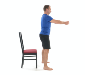man using chair for physical therapy sit stand exercise - standing